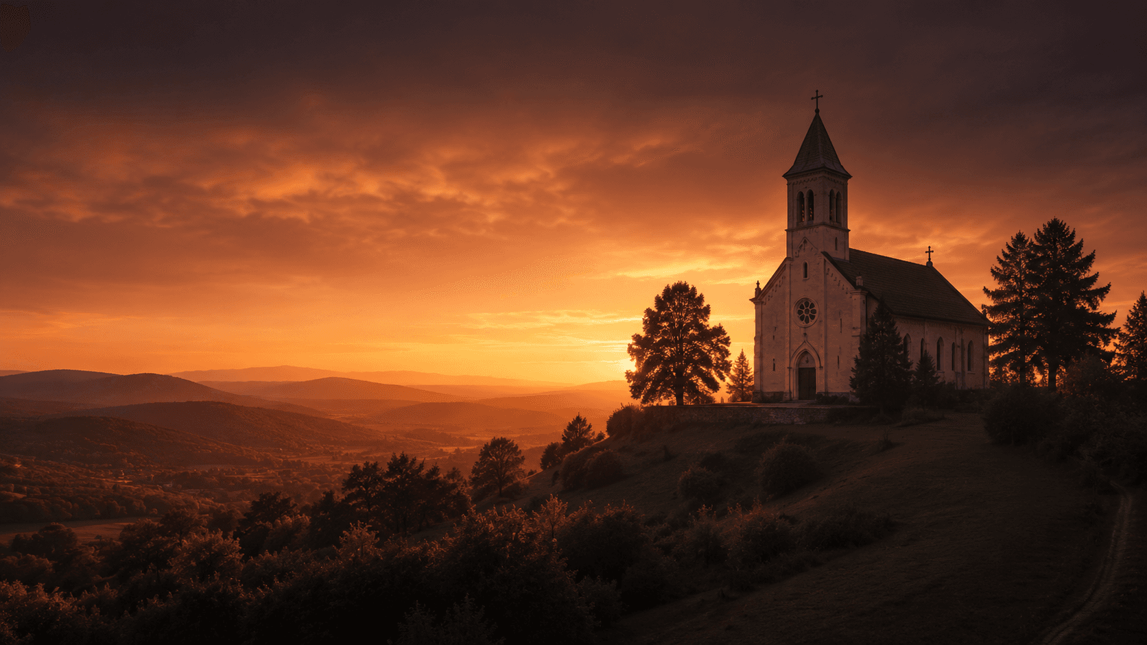 A distant view of a parish church at golden hour